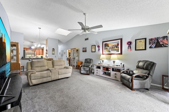 3001 SE Aster Ln Unit 908, Stuart, FL 34994 - carpeted living room with a ceiling fan, a chandelier, lofted ceiling, a skylight, and a textured ceiling