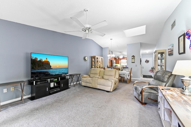 3001 SE Aster Ln Unit 908, Stuart, FL 34994 - carpeted living area featuring vaulted ceiling, a ceiling fan, a skylight, a chandelier, and baseboards