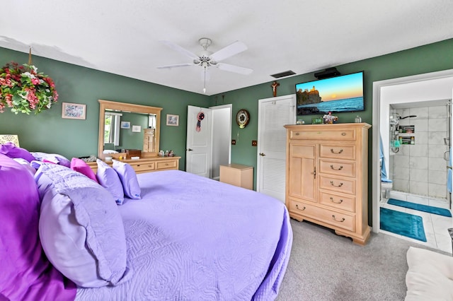 3001 SE Aster Ln Unit 908, Stuart, FL 34994 - carpeted bedroom with connected bathroom and ceiling fan