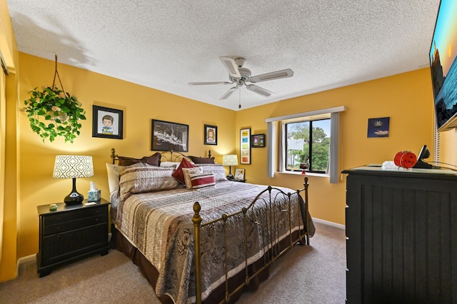 3001 SE Aster Ln Unit 908, Stuart, FL 34994 - bedroom with carpet, a textured ceiling, ceiling fan, and baseboards