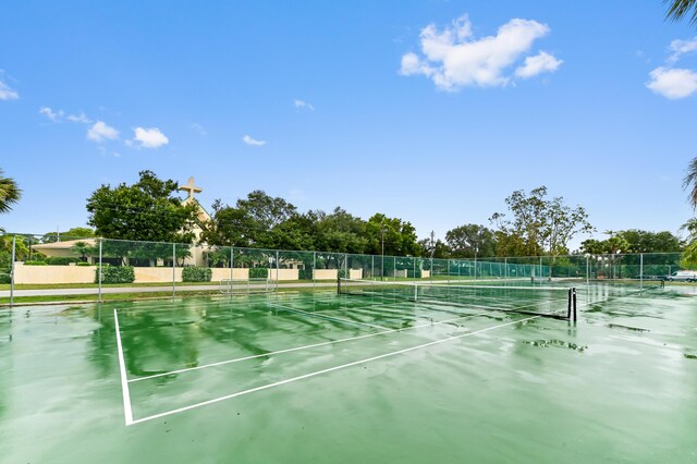 3001 SE Aster Ln Unit 908, Stuart, FL 34994 - view of tennis court with fence
