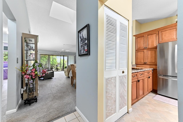3001 SE Aster Ln Unit 908, Stuart, FL 34994 - hall with light carpet and baseboards