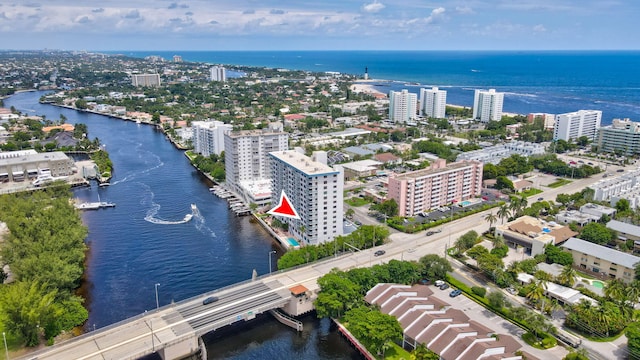 view of urban area featuring a large body of water and a notable bridge