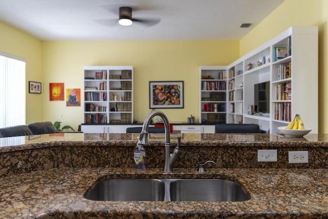 2904 SW Sutton Pl, Palm City, FL 34990 - kitchen featuring a sink, open floor plan, dark stone countertops, and ceiling fan