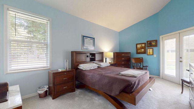 2904 SW Sutton Pl, Palm City, FL 34990 - bedroom featuring light colored carpet, lofted ceiling, multiple windows, and baseboards