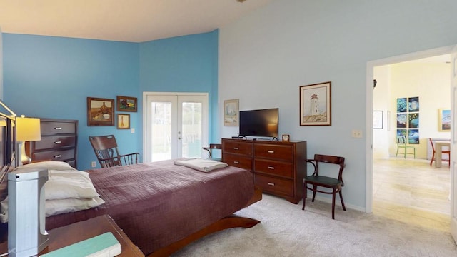 2904 SW Sutton Pl, Palm City, FL 34990 - bedroom featuring french doors, carpet, high vaulted ceiling, and baseboards
