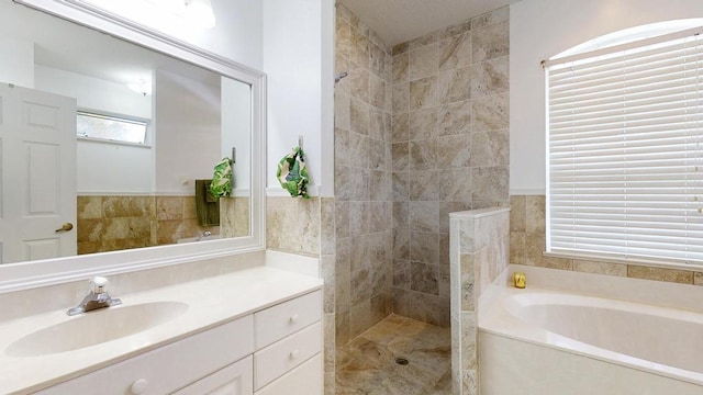 2904 SW Sutton Pl, Palm City, FL 34990 - bathroom featuring walk in shower, a garden tub, tile walls, and vanity