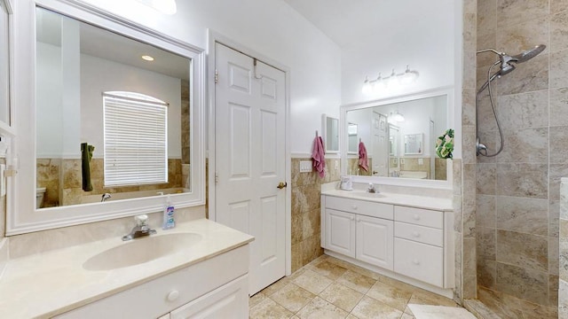 2904 SW Sutton Pl, Palm City, FL 34990 - full bath with walk in shower, two vanities, tile walls, and wainscoting