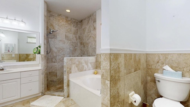 2904 SW Sutton Pl, Palm City, FL 34990 - full bath featuring a tile shower, toilet, tile walls, a garden tub, and vanity