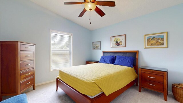 2904 SW Sutton Pl, Palm City, FL 34990 - bedroom featuring light colored carpet, vaulted ceiling, baseboards, and ceiling fan