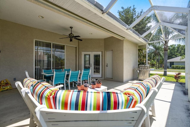 2904 SW Sutton Pl, Palm City, FL 34990 - view of patio / terrace with french doors, ceiling fan, glass enclosure, and an outdoor hangout area