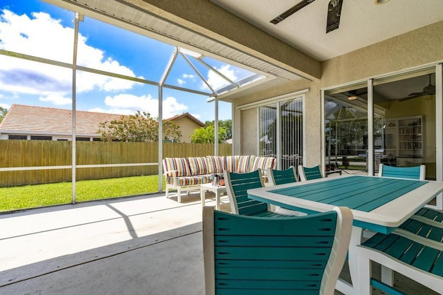 2904 SW Sutton Pl, Palm City, FL 34990 - view of patio / terrace with ceiling fan, a fenced backyard, and a lanai