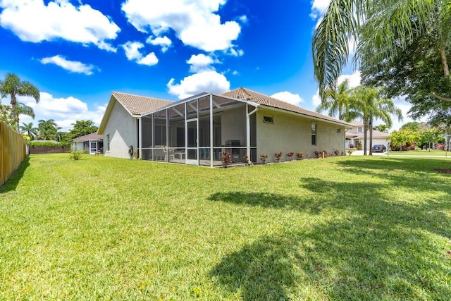2904 SW Sutton Pl, Palm City, FL 34990 - back of property with stucco siding, a tiled roof, and a lanai