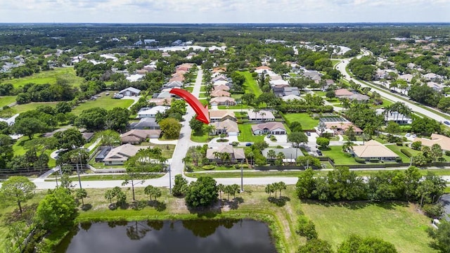 2904 SW Sutton Pl, Palm City, FL 34990 - aerial view of property and surrounding area featuring nearby suburban area and a nearby body of water