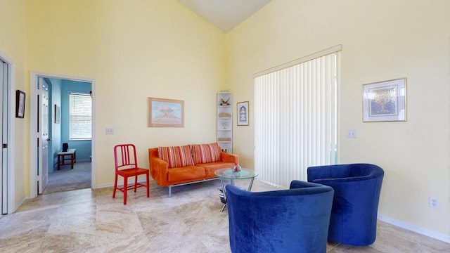 2904 SW Sutton Pl, Palm City, FL 34990 - sitting room featuring high vaulted ceiling and baseboards
