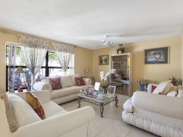 living room featuring light tile patterned flooring and a ceiling fan