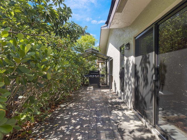 view of home's exterior featuring stucco siding and a patio area