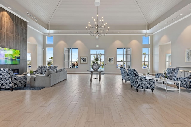 common area featuring a high ceiling, ornamental molding, and recessed lighting
