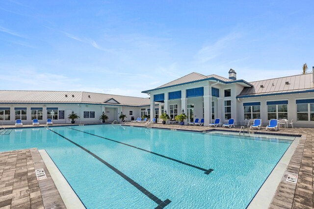 community pool featuring a patio area