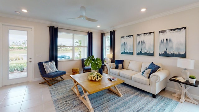 living area with light tile patterned floors, a ceiling fan, recessed lighting, crown molding, and baseboards