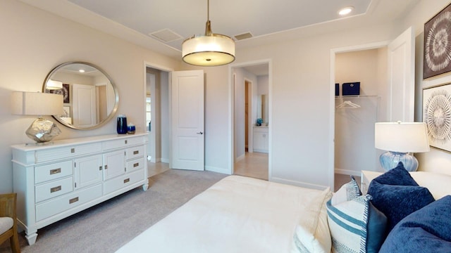 bedroom with light colored carpet, recessed lighting, and baseboards