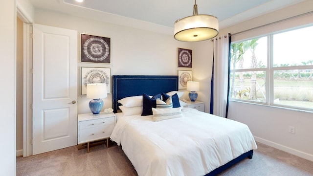 bedroom with carpet floors and baseboards