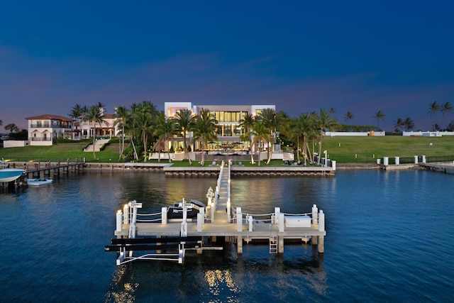 dock area featuring boat lift and a water view