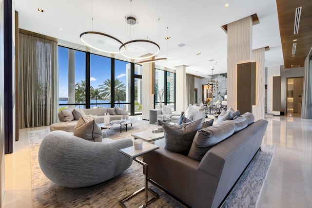 lobby featuring a wall of windows and a water view