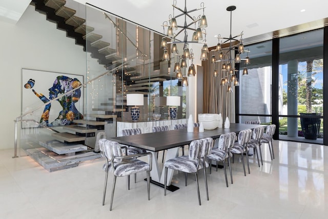 dining room featuring a chandelier, stairs, and tile patterned flooring