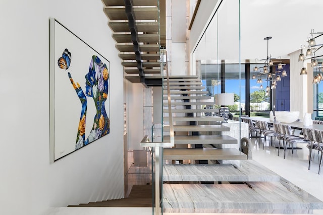 1940 S Ocean Blvd, Manalapan, FL 33462 - stairway with a chandelier