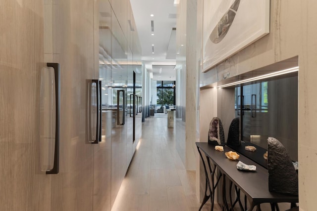 corridor featuring light wood-style floors