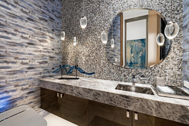 bathroom with wood walls and double vanity