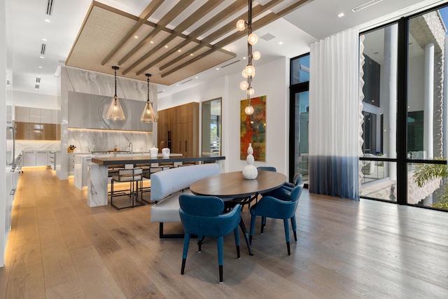 dining space with light wood-style flooring