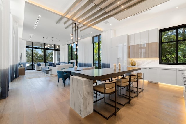 1940 S Ocean Blvd, Manalapan, FL 33462 - dining space with light wood-style floors and plenty of natural light