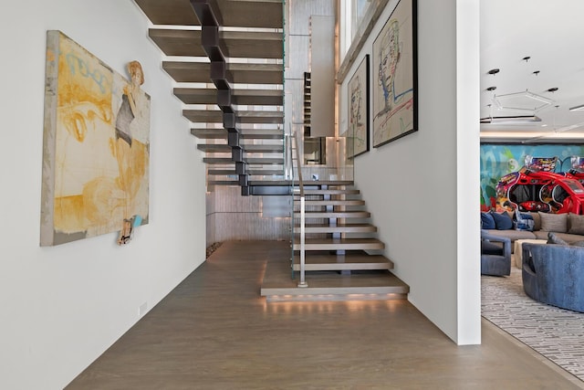 stairway with wood finished floors