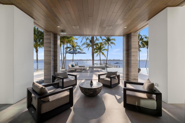view of patio featuring a water view and an outdoor hangout area