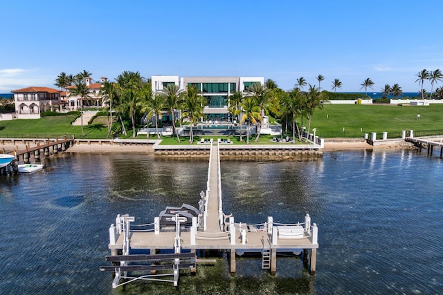 dock featuring boat lift and a water view