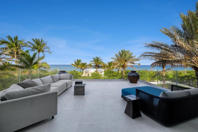 view of patio featuring outdoor lounge area and a water view