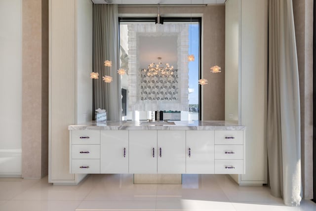 bathroom with tile patterned floors and vanity