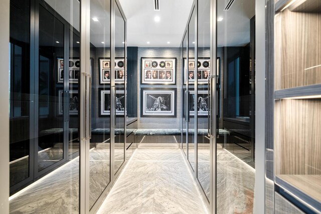 corridor with recessed lighting and french doors