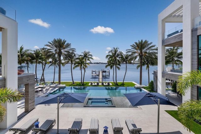 1940 S Ocean Blvd, Manalapan, FL 33462 - view of pool featuring an in-ground hot tub, a water view, and a patio area