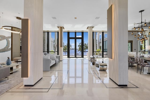 lobby with a water view and a wall of windows