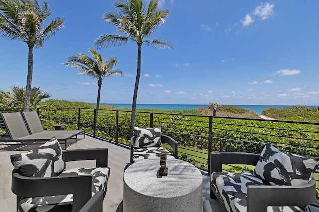 balcony featuring a water view and outdoor lounge area