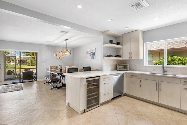 18320 181st Cir S, Boca Raton, FL 33498 - kitchen featuring beverage cooler, a sink, a peninsula, light countertops, and recessed lighting