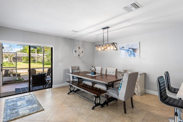 18320 181st Cir S, Boca Raton, FL 33498 - dining area featuring baseboards and light tile patterned flooring