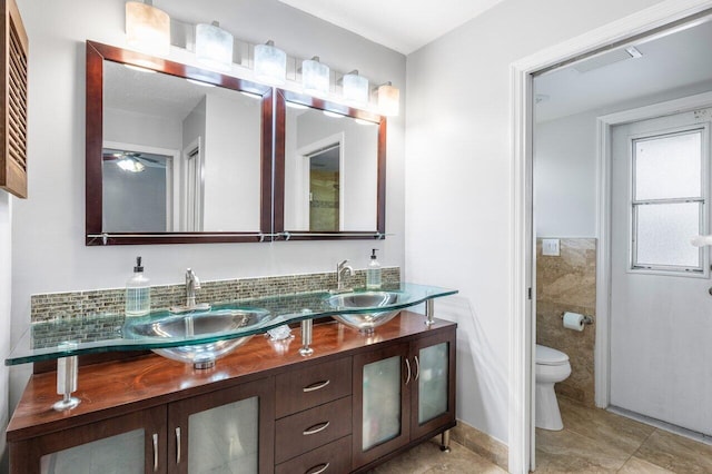 18320 181st Cir S, Boca Raton, FL 33498 - full bath featuring toilet, tile patterned flooring, double vanity, and ceiling fan