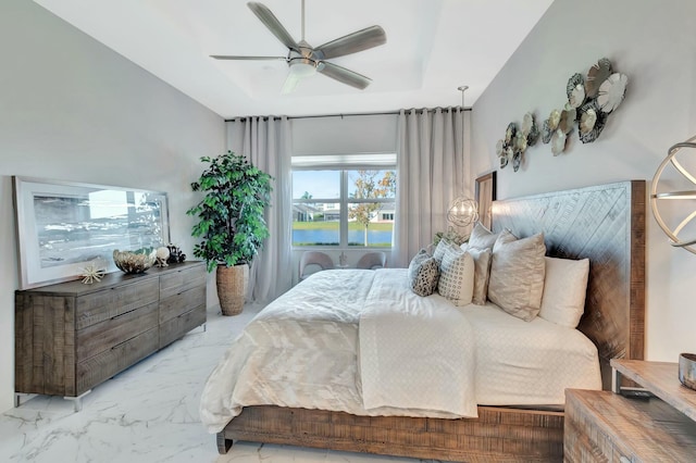 bedroom featuring marble finish floors and a ceiling fan