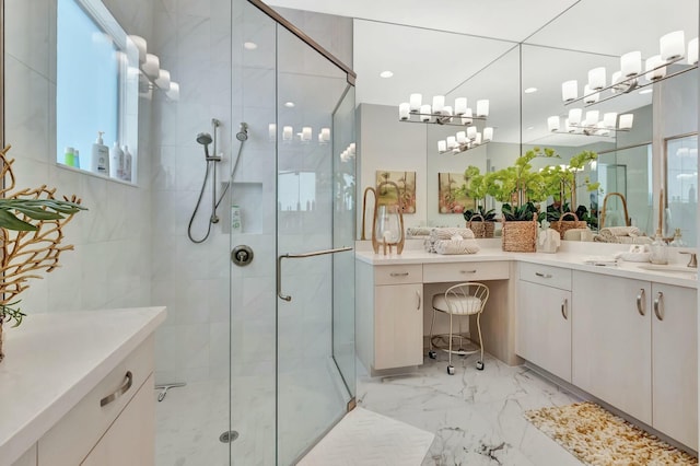 bathroom with a shower stall, marble finish floors, and vanity