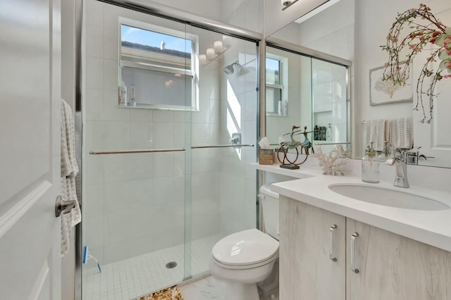 full bath with toilet, a stall shower, and vanity