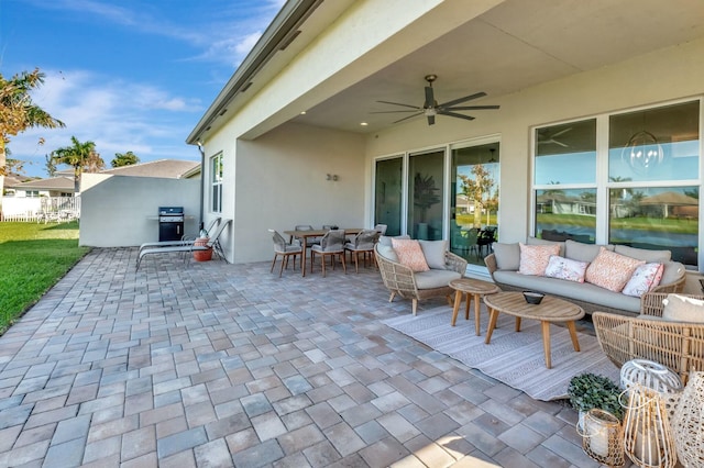 view of patio / terrace featuring a ceiling fan, outdoor lounge area, fence, and grilling area